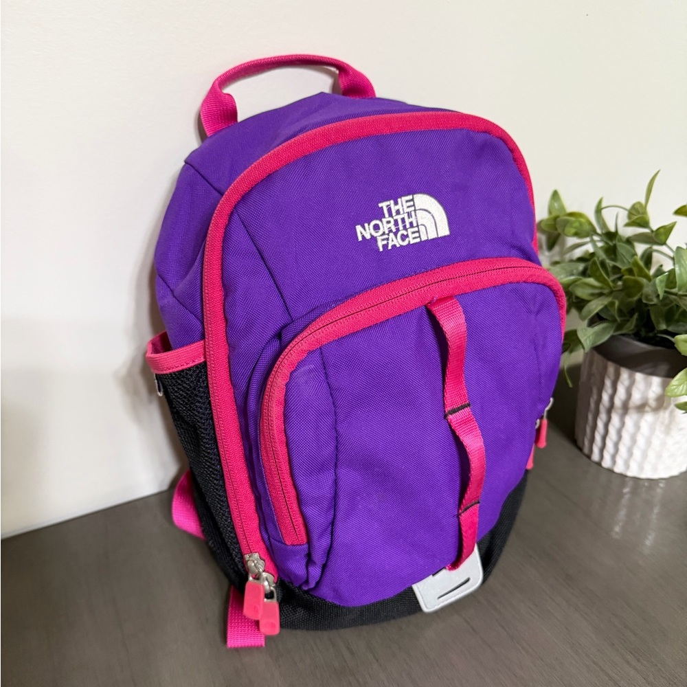 The North Face Sprout Backpack in violet with pink accents